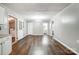 Spacious living area with wood floors and neutral paint, with lots of natural light at 26 Park Dr, Gastonia, NC 28054