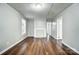 Spacious living room featuring hardwood floors, neutral paint, and a decorative fireplace at 26 Park Dr, Gastonia, NC 28054