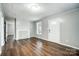 Cozy living room featuring wood floors, fireplace, and a bright window at 26 Park Dr, Gastonia, NC 28054
