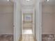 Hallway view of bathroom featuring tile flooring and large bathtub at 276 Annatto Way, Tega Cay, SC 29708