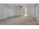 Bright bedroom with plush carpeting, ceiling fan, and natural light from large window at 276 Annatto Way, Tega Cay, SC 29708