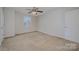 Simple bedroom with neutral decor, a ceiling fan, and carpeted floors at 276 Annatto Way, Tega Cay, SC 29708