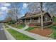 Charming community clubhouse with inviting walkway, stone accents, and manicured landscaping at 276 Annatto Way, Tega Cay, SC 29708