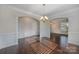 Well-lit dining area with hardwood floors and elegant architectural details at 276 Annatto Way, Tega Cay, SC 29708