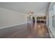 Spacious living room featuring hardwood floors, neutral paint, stairs to second level, and an open layout at 276 Annatto Way, Tega Cay, SC 29708
