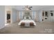 Main bedroom featuring a walk-in closet, a ceiling fan and ample natural light at 276 Annatto Way, Tega Cay, SC 29708