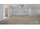 Spacious main bedroom with neutral carpet, closet storage and natural lighting at 276 Annatto Way, Tega Cay, SC 29708