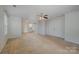 Expansive main bedroom with walk-in closet, a ceiling fan and carpet at 276 Annatto Way, Tega Cay, SC 29708
