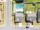 Aerial view of a backyard with a private pool, hot tub, and landscaped area for relaxing and entertaining at 3124 Berry Creek Rd, Charlotte, NC 28214