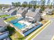 Aerial view of a home with a private backyard oasis featuring a pool, hot tub, and outdoor kitchen at 3124 Berry Creek Rd, Charlotte, NC 28214