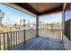 Relaxing covered balcony with a view of the neighborhood and plenty of natural light at 3124 Berry Creek Rd, Charlotte, NC 28214