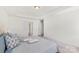 Bright bedroom with a tray ceiling, neutral paint and carpet, plus ample closet space at 3124 Berry Creek Rd, Charlotte, NC 28214