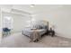 Tranquil bedroom with soft carpet, natural light, and neutral tones for a relaxing retreat at 3124 Berry Creek Rd, Charlotte, NC 28214