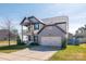 Charming two-story home with a covered porch, balcony, manicured lawn and attached two-car garage at 3124 Berry Creek Rd, Charlotte, NC 28214