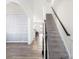 Bright foyer featuring hardwood floors, staircase, and decorative wall trim at 3124 Berry Creek Rd, Charlotte, NC 28214