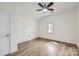This bedroom offers ample space, natural light, and a ceiling fan at 3225 Liberty Rd, Gold Hill, NC 28071
