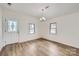 Dining room featuring laminate floors, modern lighting, and ample natural light at 3225 Liberty Rd, Gold Hill, NC 28071