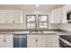 Kitchen detail of granite countertops, white cabinets, and stainless steel dishwasher at 3225 Liberty Rd, Gold Hill, NC 28071