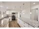 Kitchen with granite countertops, white cabinets, stainless steel microwave and oven combo at 3225 Liberty Rd, Gold Hill, NC 28071