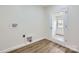 A laundry room boasts vinyl floors and washer hookups, ensuring convenience at 3225 Liberty Rd, Gold Hill, NC 28071