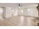 Bright living room with fireplace, ceiling fan, laminate floors and white walls at 3225 Liberty Rd, Gold Hill, NC 28071