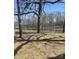 Beautiful view of a large, well-maintained pond surrounded by mature trees on a sunny day at 3225 Liberty Rd, Gold Hill, NC 28071