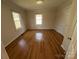 Well-lit bedroom featuring wood-look flooring, neutral walls, and windows providing ample natural light at 325 Orr Dr, Rock Hill, SC 29730