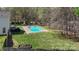 Aerial view of backyard with pool, patio, and fire pit at 3904 Crimson Wing Dr, Indian Trail, NC 28079