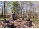 Backyard with a fire pit, seating, and shed at 3904 Crimson Wing Dr, Indian Trail, NC 28079