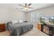 Comfortable bedroom featuring a ceiling fan, plush bedding, and a mounted television at 3904 Crimson Wing Dr, Indian Trail, NC 28079