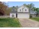 Charming two-story home featuring a well-manicured lawn and attached two-car garage at 3904 Crimson Wing Dr, Indian Trail, NC 28079