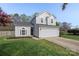 Charming two-story home boasts an attached two-car garage and a well-manicured lawn at 3904 Crimson Wing Dr, Indian Trail, NC 28079