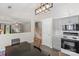 Open eat-in kitchen offering modern cabinetry, stainless appliances and hardwood floors at 3904 Crimson Wing Dr, Indian Trail, NC 28079