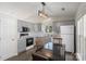 Eat-in kitchen with gray cabinets, modern appliances, and stylish lighting at 3904 Crimson Wing Dr, Indian Trail, NC 28079