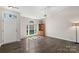 Bright living room with beautiful hardwood floors, a ceiling fan, and natural light at 3904 Crimson Wing Dr, Indian Trail, NC 28079