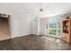 Inviting living room showcasing natural light, wood floors, and access to the stairway at 3904 Crimson Wing Dr, Indian Trail, NC 28079