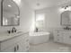 Elegant bathroom featuring dual vanities, soaking tub, marble countertops and floors, and framed mirrors at 3907 E Lawyers Rd, Monroe, NC 28110