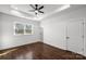 Bright bedroom featuring hardwood floors, tray ceiling and abundant natural light at 3907 E Lawyers Rd, Monroe, NC 28110