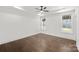 Spacious bedroom with hardwood floors, natural light, large windows, and neutral tones at 3907 E Lawyers Rd, Monroe, NC 28110