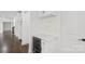 The kitchen features sleek white cabinetry, marble countertops and backsplash, stainless mini fridge, and modern fixtures at 3907 E Lawyers Rd, Monroe, NC 28110