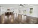 Expansive living area showcasing hardwood floors, ample natural light, and seamless flow to the kitchen at 3907 E Lawyers Rd, Monroe, NC 28110