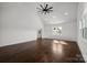 Bright living room with vaulted ceilings, recessed lighting, and gleaming hardwood floors at 3907 E Lawyers Rd, Monroe, NC 28110