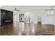 Open-concept living room with hardwood floors, fireplace, and staircase at 3907 E Lawyers Rd, Monroe, NC 28110