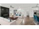 Staged living room featuring a modern fireplace, hardwood floors, and comfortable seating at 3907 E Lawyers Rd, Monroe, NC 28110