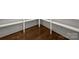 Walk-in pantry with hardwood floors and custom built-in shelving ready for storage and organization at 3907 E Lawyers Rd, Monroe, NC 28110