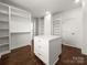 Bright walk-in closet with custom shelving and drawers, plus center storage island at 3907 E Lawyers Rd, Monroe, NC 28110