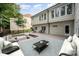 Inviting backyard with a multi-level deck, cozy fire pit, and comfortable seating, ideal for outdoor gatherings at 4012 Cambridge Hill Ln, Charlotte, NC 28270