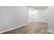 Bare bedroom with natural light, hardwood flooring, and neutral paint at 4012 Cambridge Hill Ln, Charlotte, NC 28270