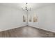Bright bedroom with hardwood floors and natural light from the windows at 4012 Cambridge Hill Ln, Charlotte, NC 28270