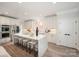 Modern kitchen featuring an island with bar seating, stainless steel appliances, and sleek countertops at 4012 Cambridge Hill Ln, Charlotte, NC 28270